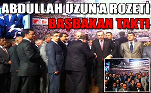 Rozetini Başbakan taktı...