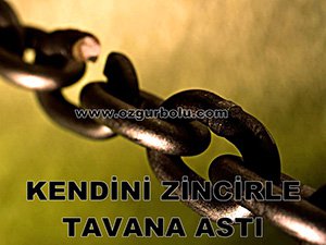 KENDİNİ ZİNCİRLE TAVANA ASTI