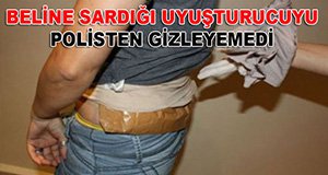 Uyuşturucuyu beline sardı