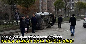 LASTİĞİ PATLAYAN OTOMOBİL REFÜJE DALDI