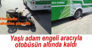 ENGELİ ARACIYLA OTOBÜSÜN ALTINA GİRDİ