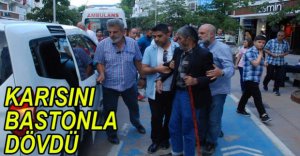 KARISINI BASTONLA DÖVDÜ