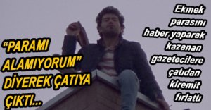 İNŞAATIN ÇATISINA ÇIKTI, GAZETECİLERE KİREMİT FIRLATTI