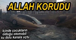 OTOMOBİL SU DOLU KANALA UÇTU