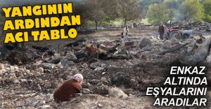 ENKAZ ALTINDA EŞYALARINI ARADILAR