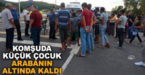 KÜÇÜK ÇOCUK ARABANIN ALTINDA KALDI