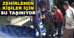 ZEHİRLENEN   KİŞİLER İÇİN  SU TAŞINIYOR