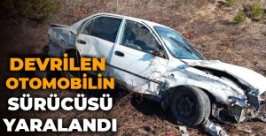 DEVRİLEN OTOMOBİLİN SÜRÜCÜSÜ YARALANDI