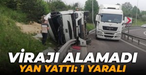 VİRAJI ALAMAYAN TIR, YAN YATTI