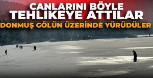 CANLARINI BÖYLE TEHLİKEYE ATTILAR: DONMUŞ GÖLÜN ÜZERİNDE YÜRÜDÜLER