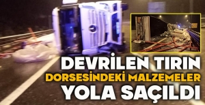 DEVRİLEN TIRIN DORSESİNDEKİ MALZEMELER YOLA SAÇILDI