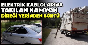 ELEKTRİK KABLOLARINA TAKILAN KAMYON DİREĞİ YERİNDEN SÖKTÜ