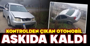 KONTROLDEN ÇIKAN OTOMOBİL ASKIDA KALDI