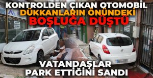 KONTROLDEN ÇIKAN OTOMOBİL  DÜKKANLARIN ÖNÜNDEKİ BOŞLUĞA DÜŞTÜ: VATANDAŞLAR PARK ETTİĞİNİ SANDI