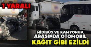 MİDİBÜS VE KAMYONUN  ARASINDA OTOMOBİL KAĞIT GİBİ EZİLDİ: 1 YARALI