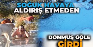 SOĞUK HAVAYA ALDIRIŞ ETMEDEN DONMUŞ GÖLE GİRDİ