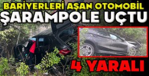 TEM'DE BARİYERLERİ AŞAN OTOMOBİL ŞARAMPOLE UÇTU: 4 YARALI