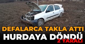 YOLDAN ÇIKAN OTOMOBİL DEFALARCA TAKLA ATARAK HURDAYA DÖNDÜ: 2 YARALI