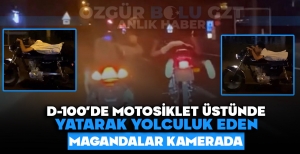 D-100'DE MOTORSİKLET ÜSTÜNDE YATARAK YOLCULUK EDEN MAGANDALAR KAMERADA