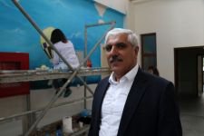 ENGELLİ ÇOCUKLAR İÇİN DUVARLARI BOYUYORLAR