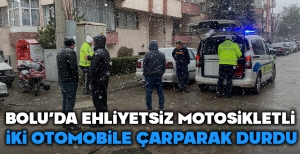 BOLU'DA EHLİYETSİZ MOTOSİKLETLİ İKİ ARACA ÇARPARAK DURABİLDİ....